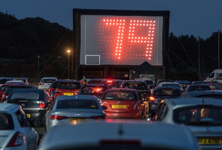 Drive in bingo outdoors on a big screen